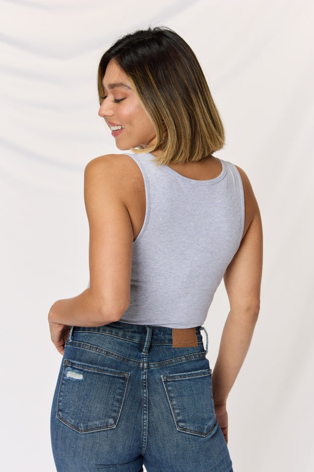 Square neck wide strap cropped cami, opaque and moderately stretchy.