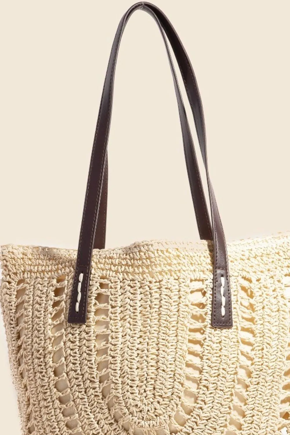 Medium straw braided rounded tote bag.