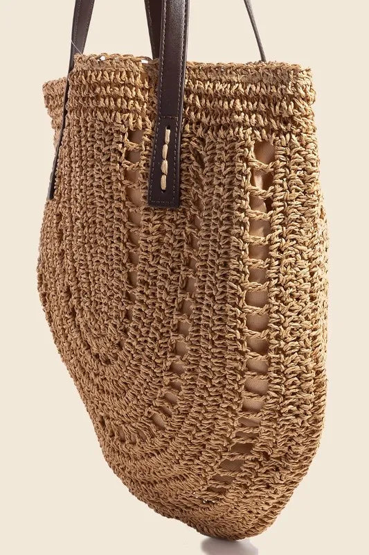 Medium straw braided rounded tote bag.
