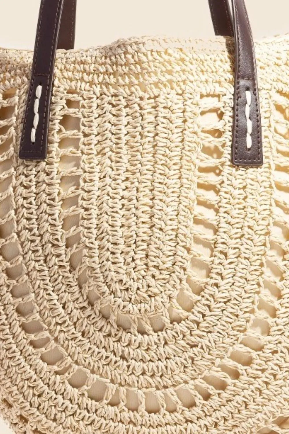 Medium straw braided rounded tote bag.