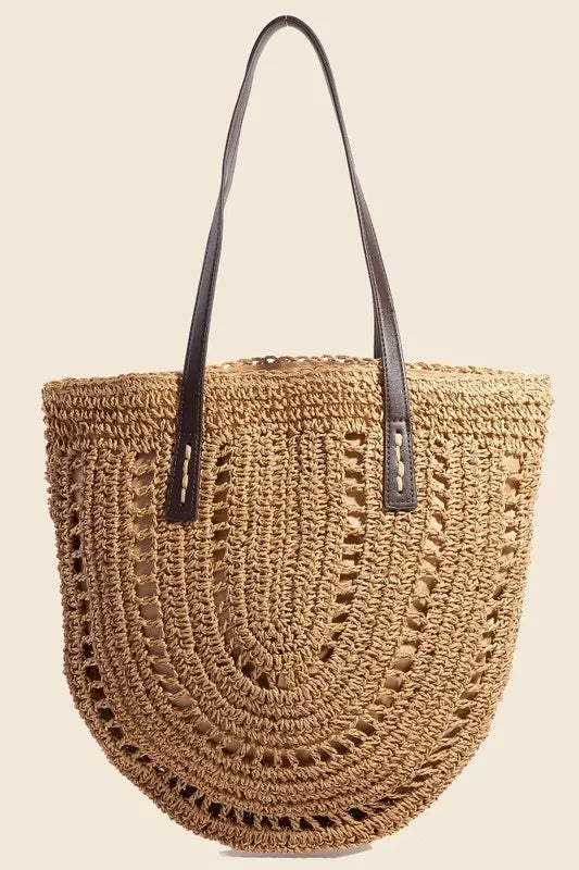 Medium straw braided rounded tote bag.