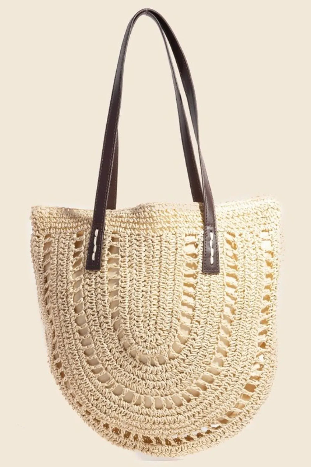 Medium straw braided rounded tote bag.