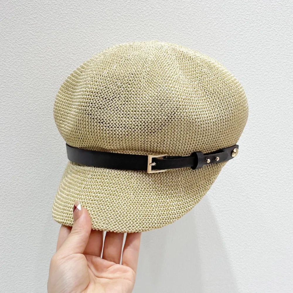 Stylish straw woven hat with a decorative buckle.