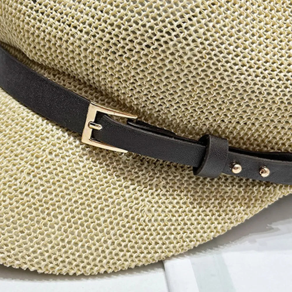 Stylish straw woven hat with a decorative buckle.