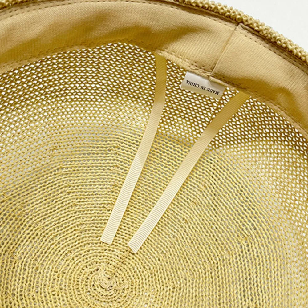 Stylish straw woven hat with a decorative buckle.
