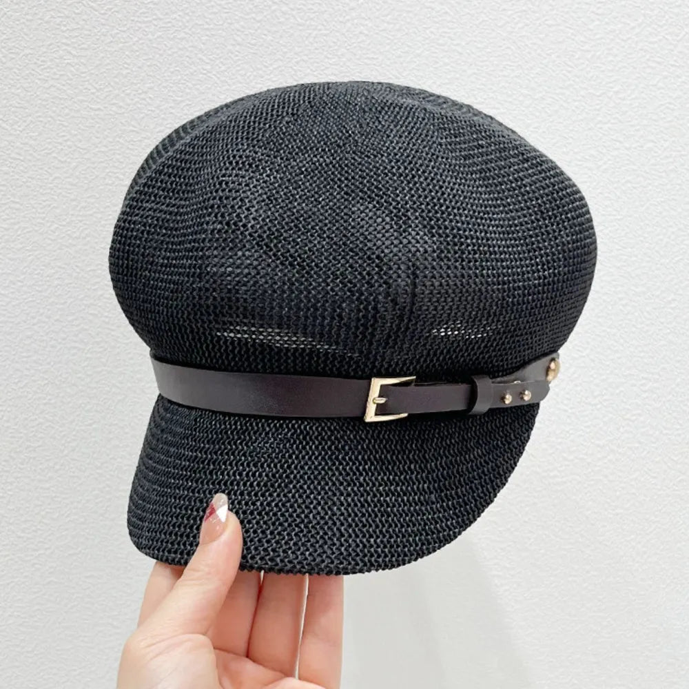 Stylish straw woven hat with a decorative buckle.