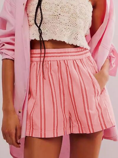 Heart-pattern rolled hem denim shorts with pockets.