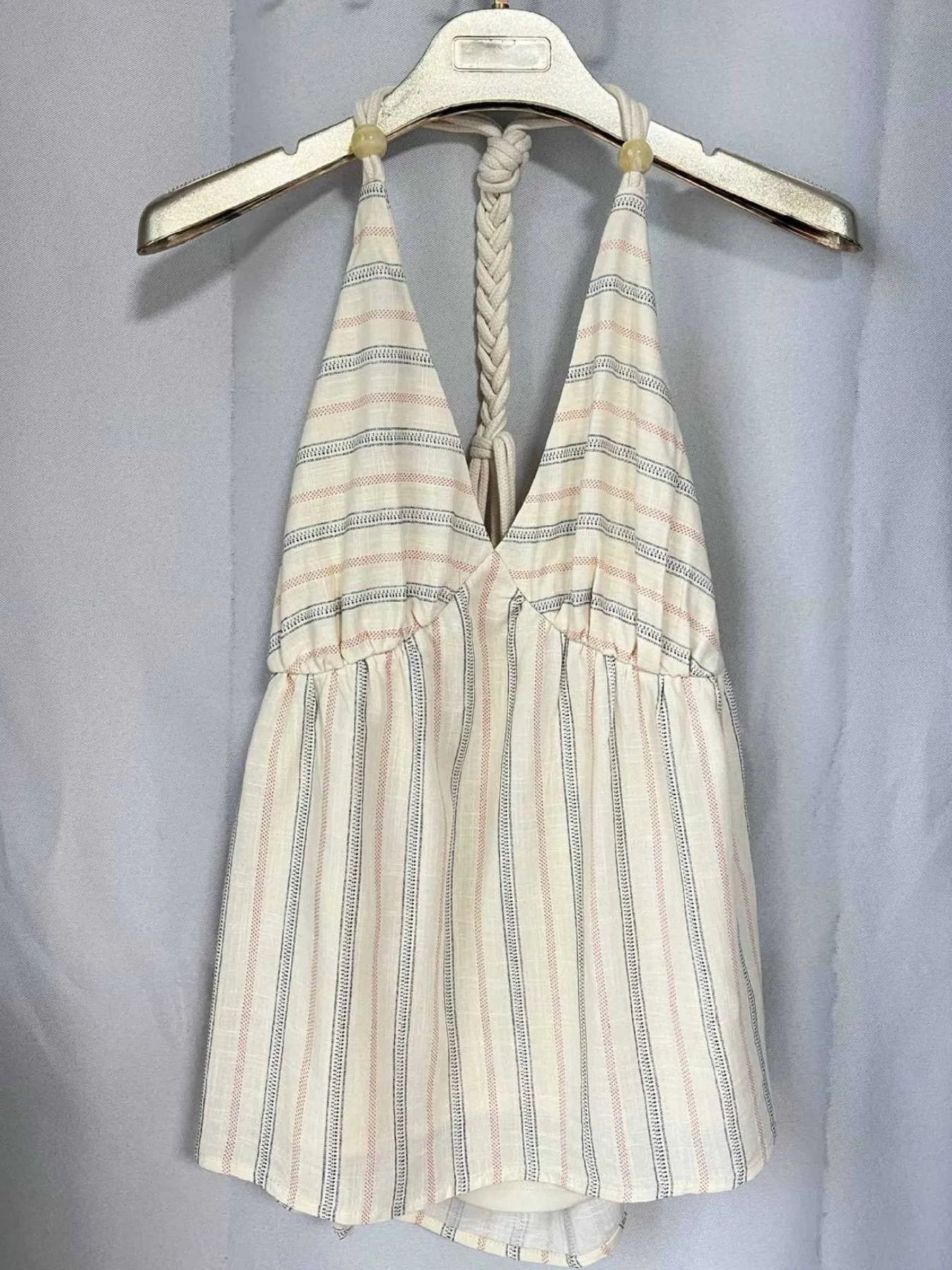 Striped halter neck cami with braided and crisscross smocked details.