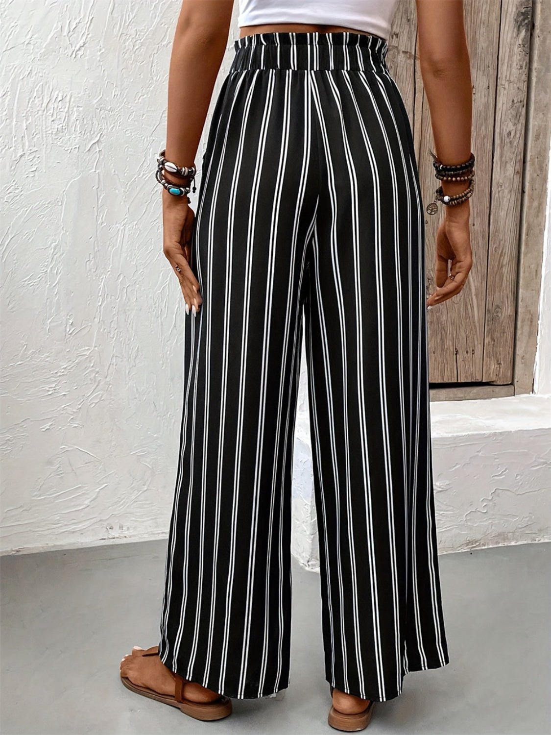 Striped high waist wide leg pants with tie and pockets, opaque.
