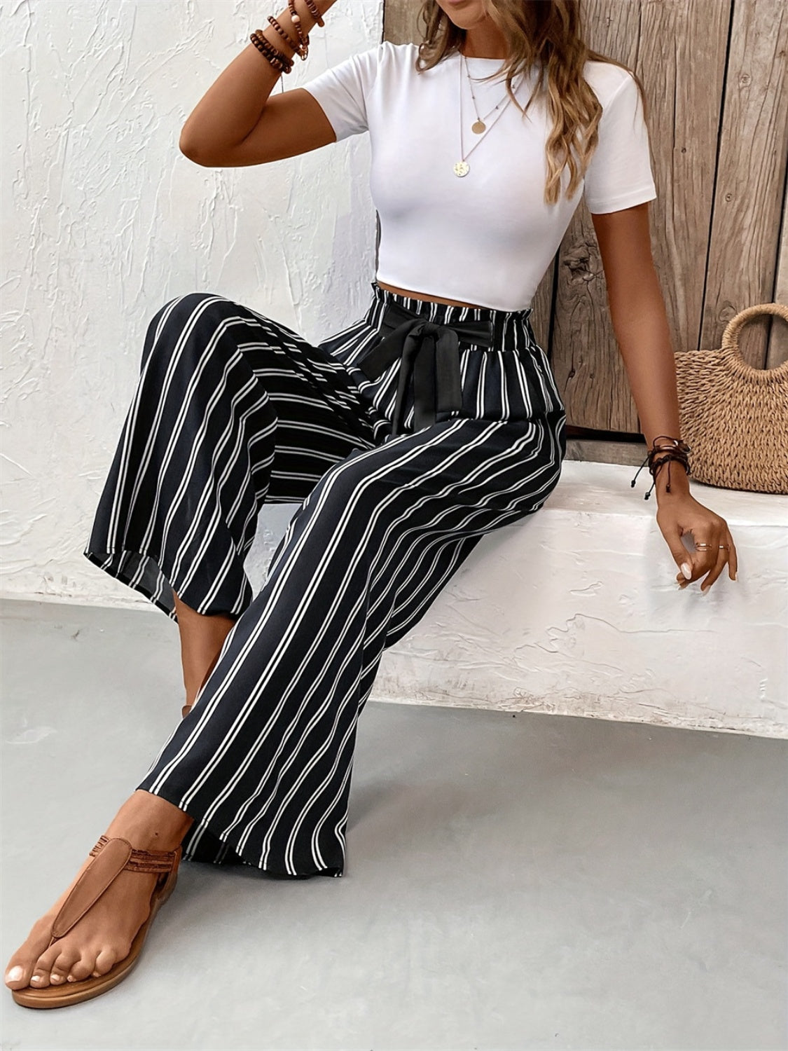 Striped high waist wide leg pants with tie and pockets, opaque.