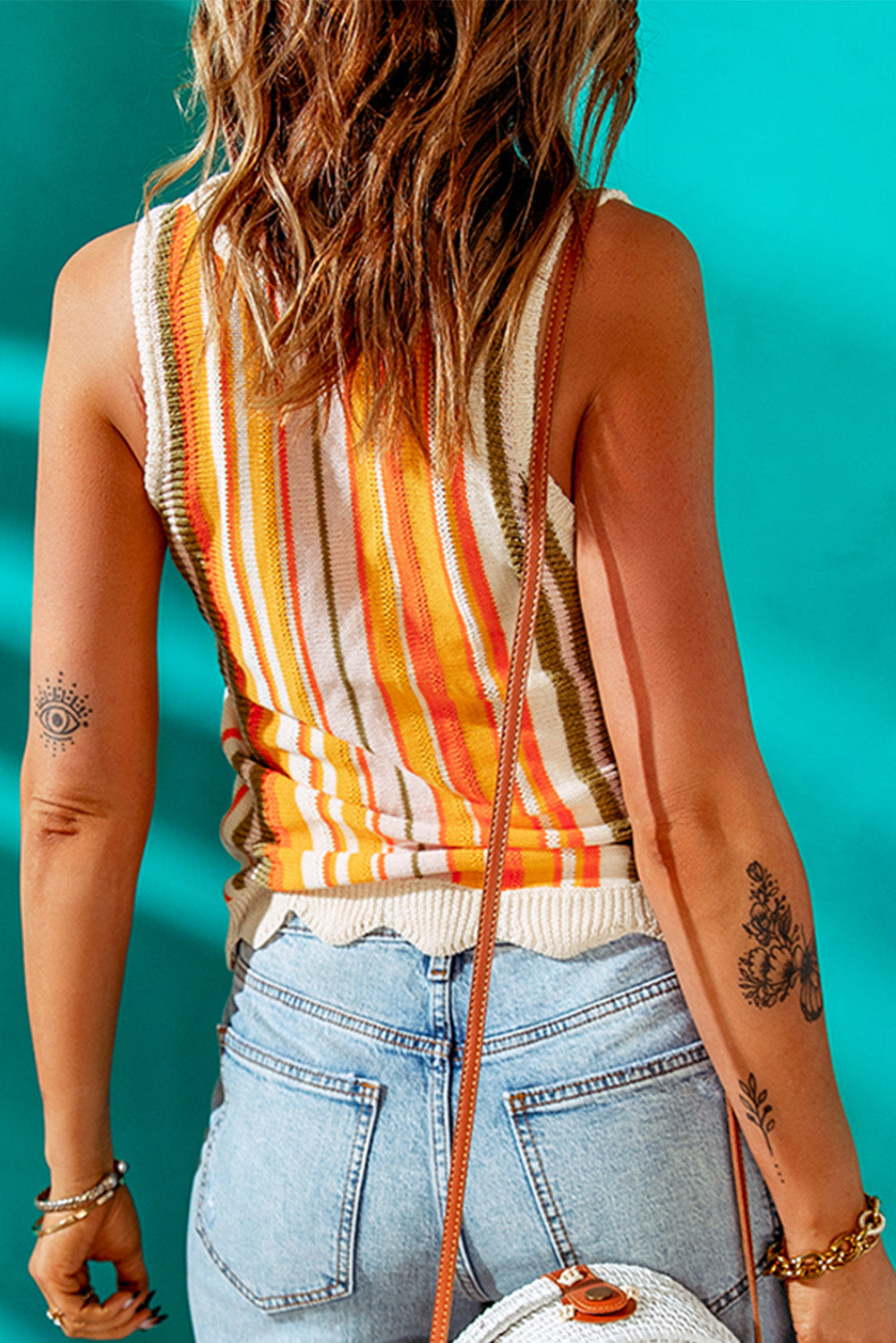 Striped knitted tank with scalloped hem.
