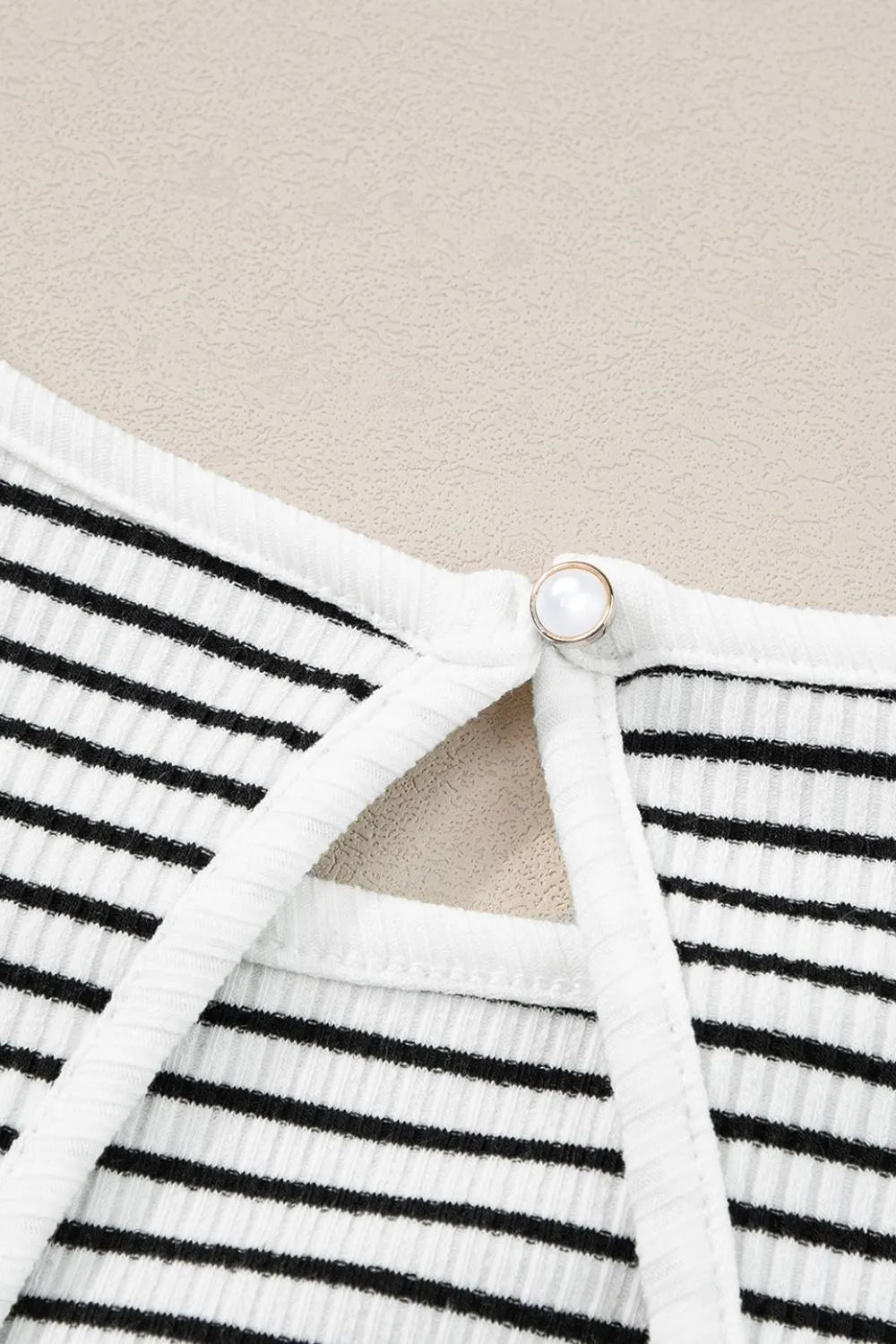Striped ribbed round neck tank with cutout, opaque and slightly stretchy.