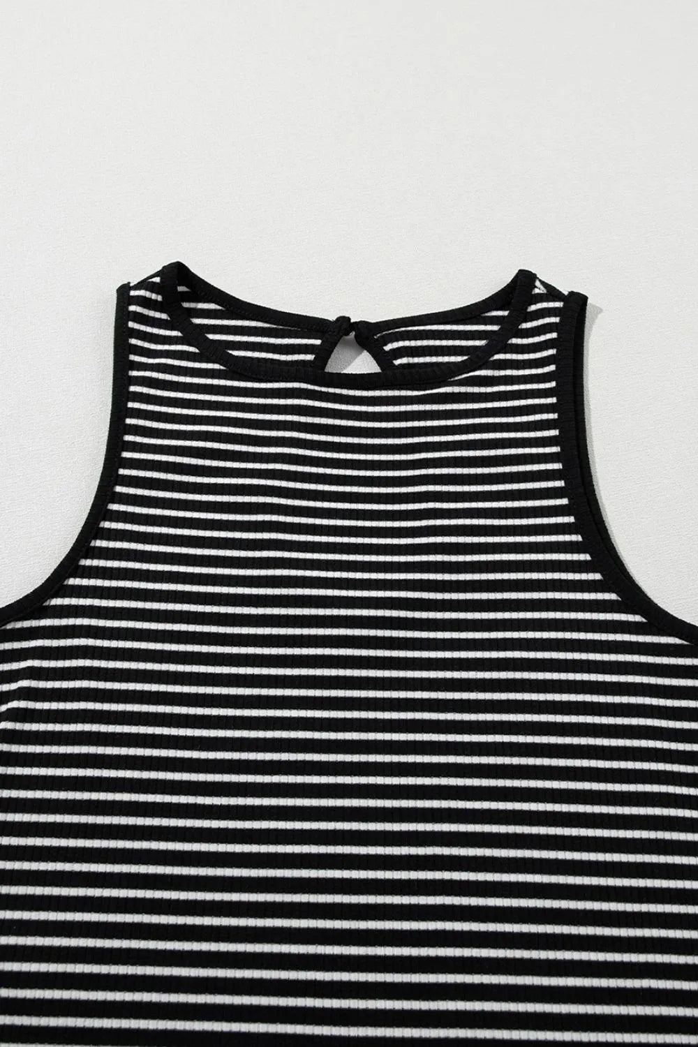 Striped ribbed round neck tank with cutout, opaque and slightly stretchy.