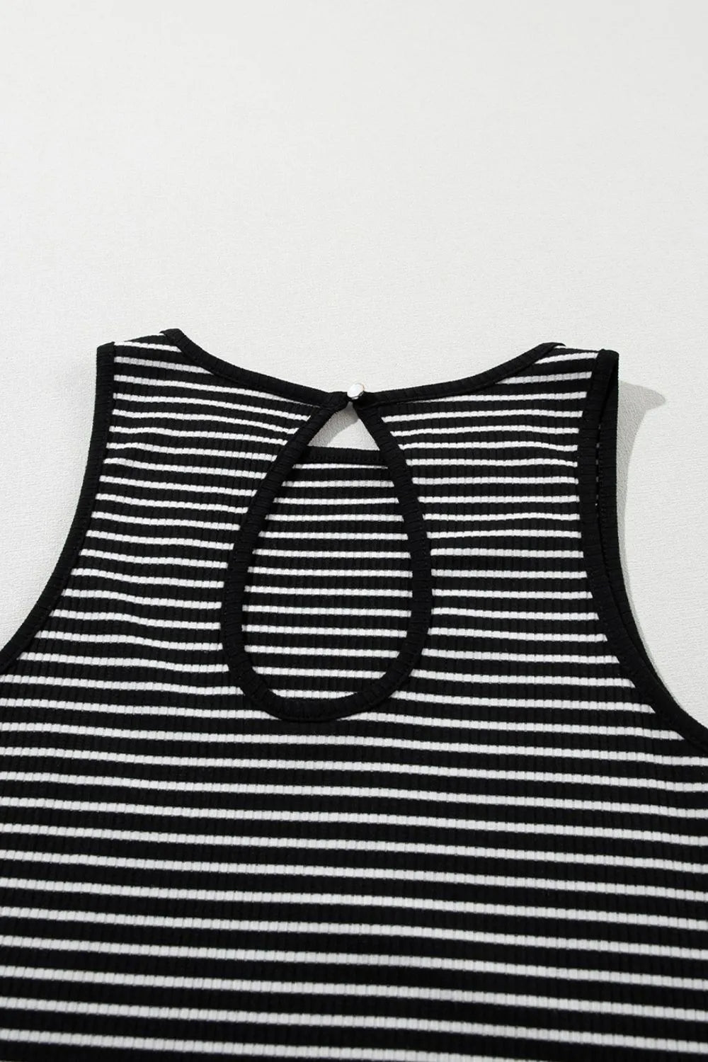 Striped ribbed round neck tank with cutout, opaque and slightly stretchy.