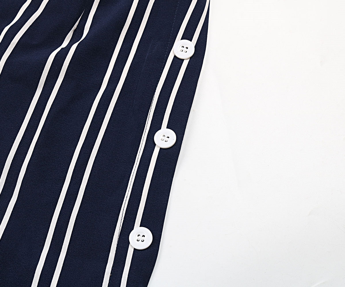 Striped slit wide leg pants with decorative buttons, casual minimalist style.