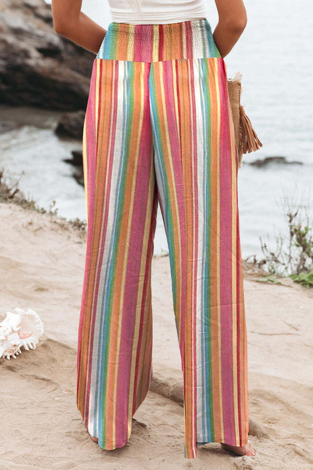 Striped smocked waist pants with pockets, casual style.