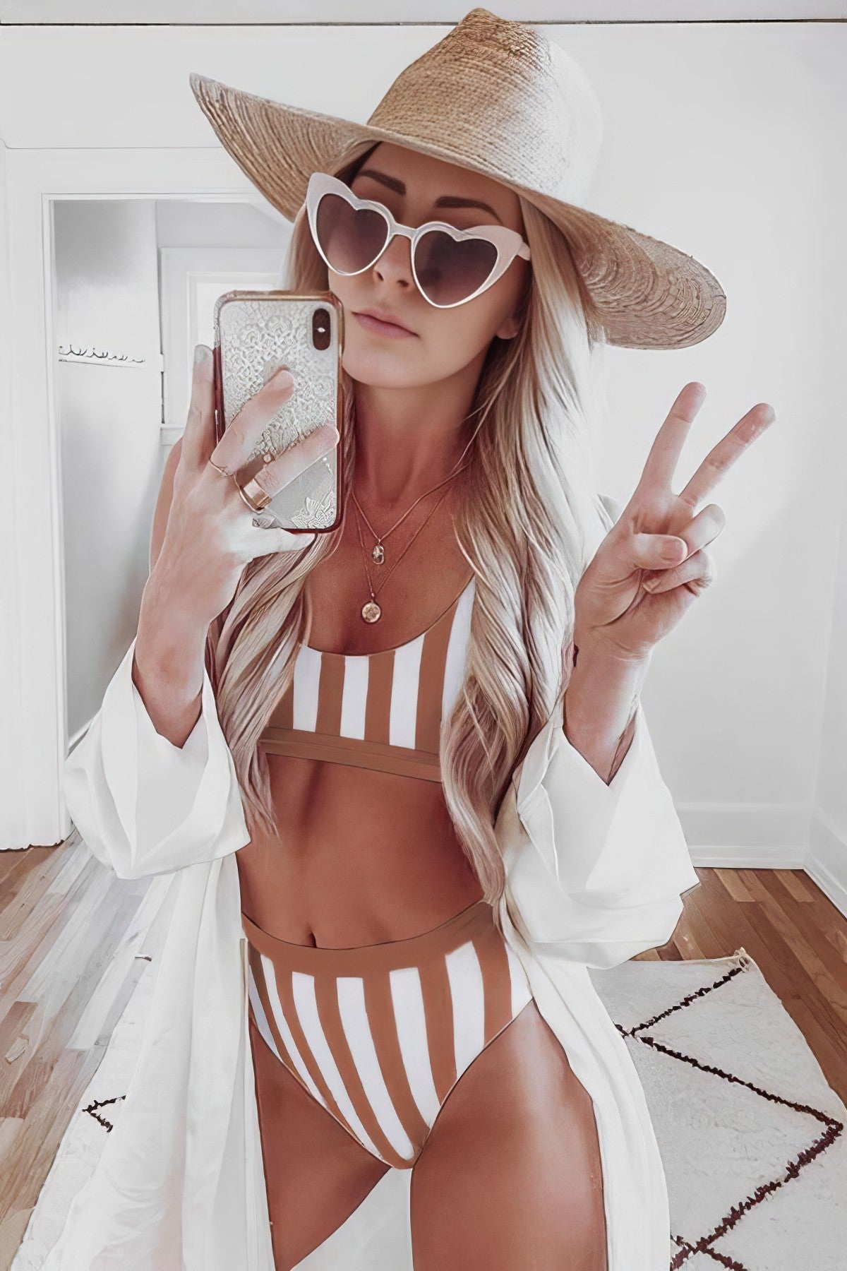 Striped high-waist bikini with a tank top and a crop vest.