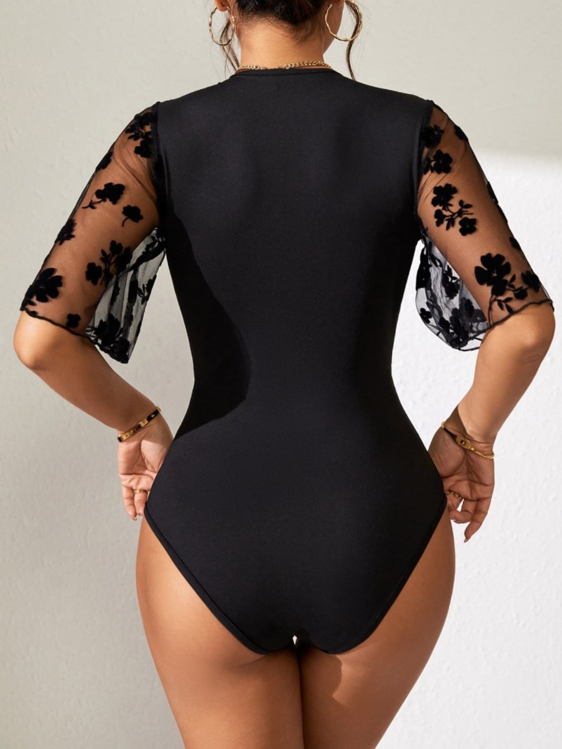 Surplice Lace Flutter Sleeve Bodysuit.