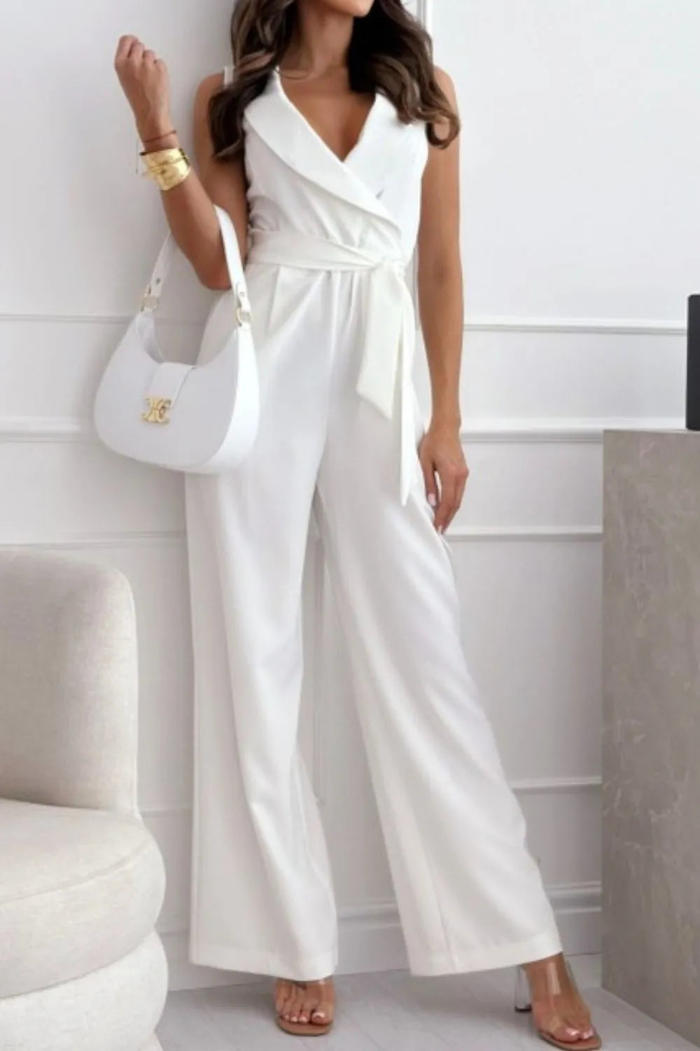 Surplice Sleeveless Wide Leg Jumpsuit with Tie and Pockets.