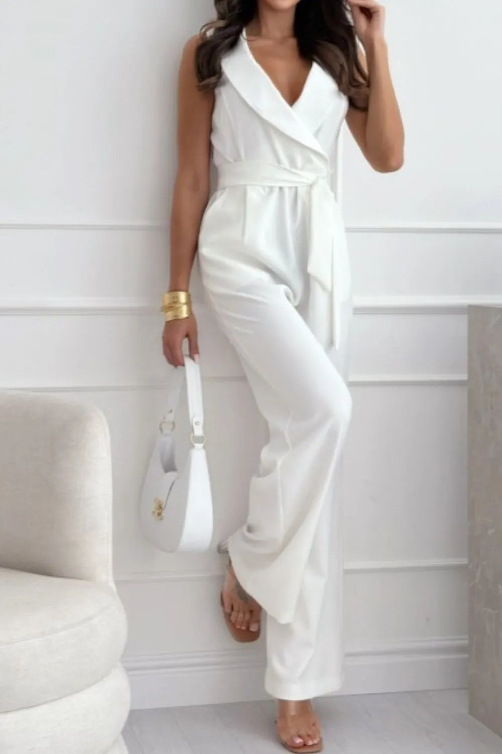 Surplice Sleeveless Wide Leg Jumpsuit with Tie and Pockets.