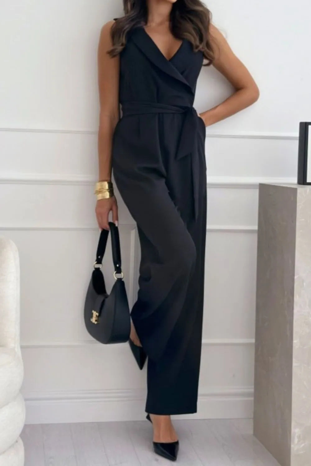 Surplice Sleeveless Wide Leg Jumpsuit with Tie and Pockets.