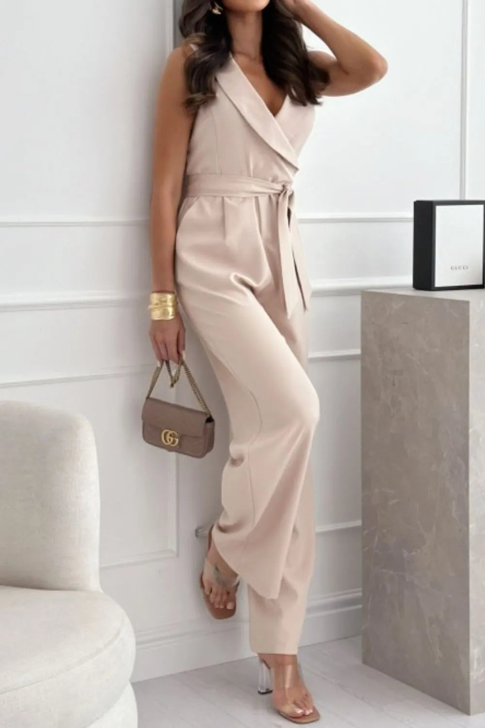 Surplice Sleeveless Wide Leg Jumpsuit with Tie and Pockets.