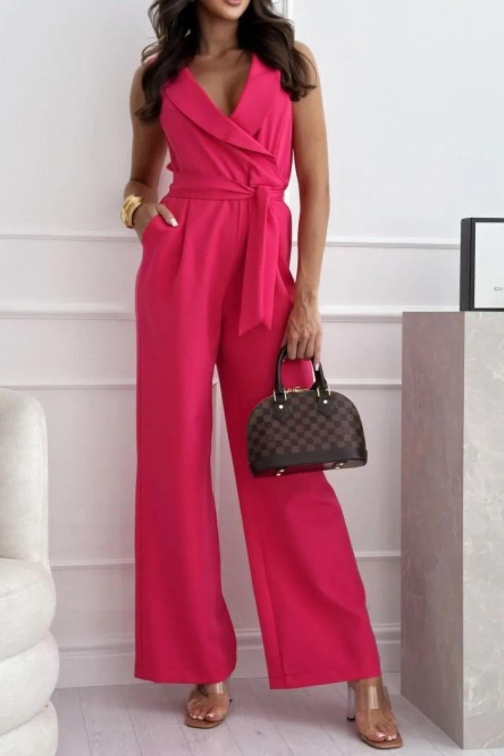 Surplice Sleeveless Wide Leg Jumpsuit with Tie and Pockets.