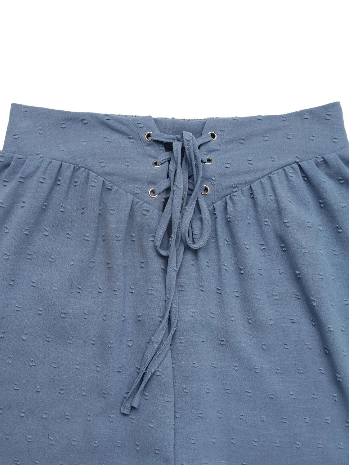High-waist V-front Bermuda denim shorts with pockets.
