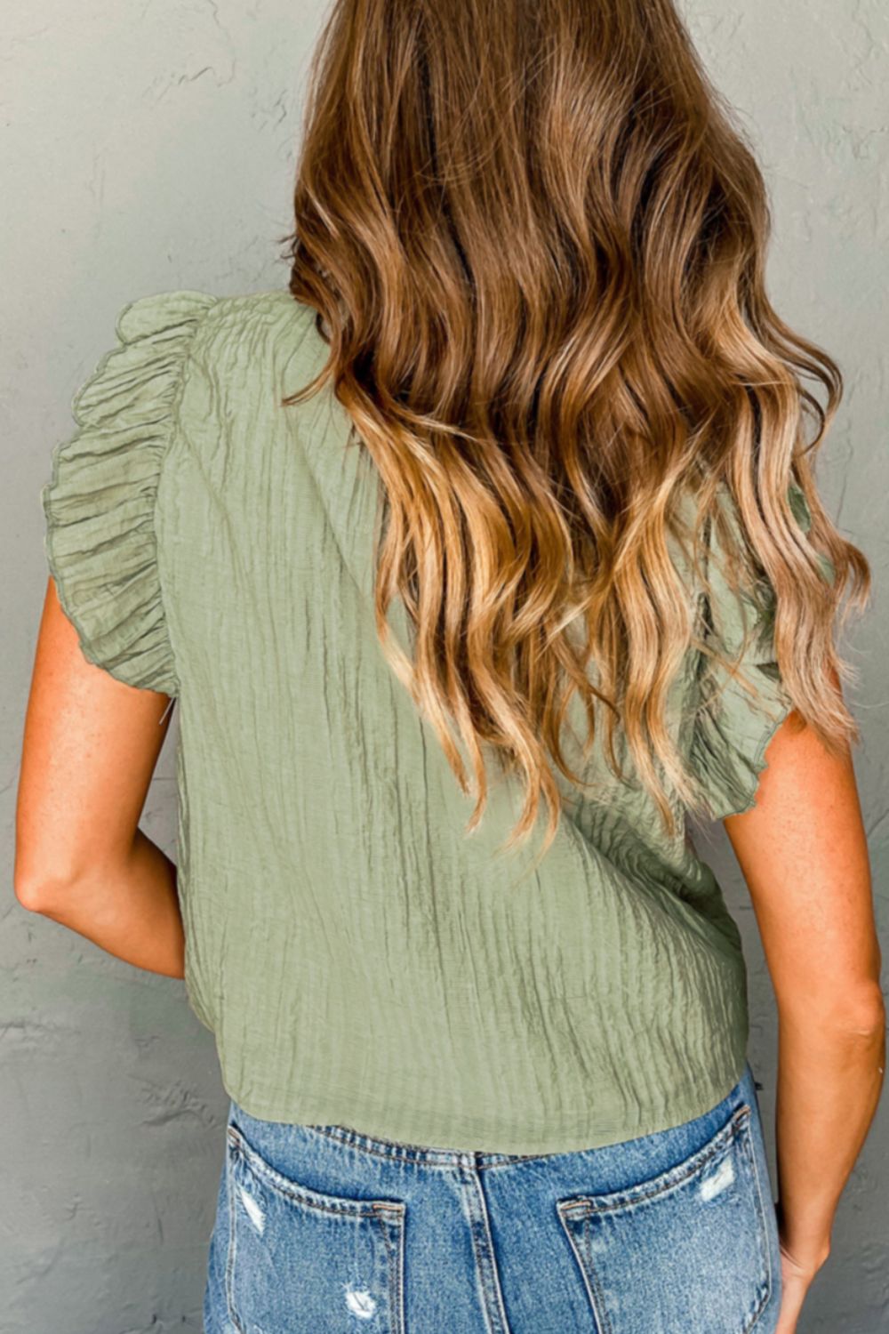 Tassel Tie Neck Flutter Sleeve Textured Blouse.