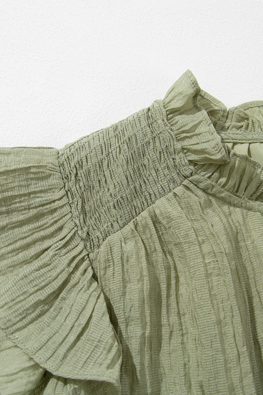 Tassel Tie Neck Flutter Sleeve Textured Blouse.