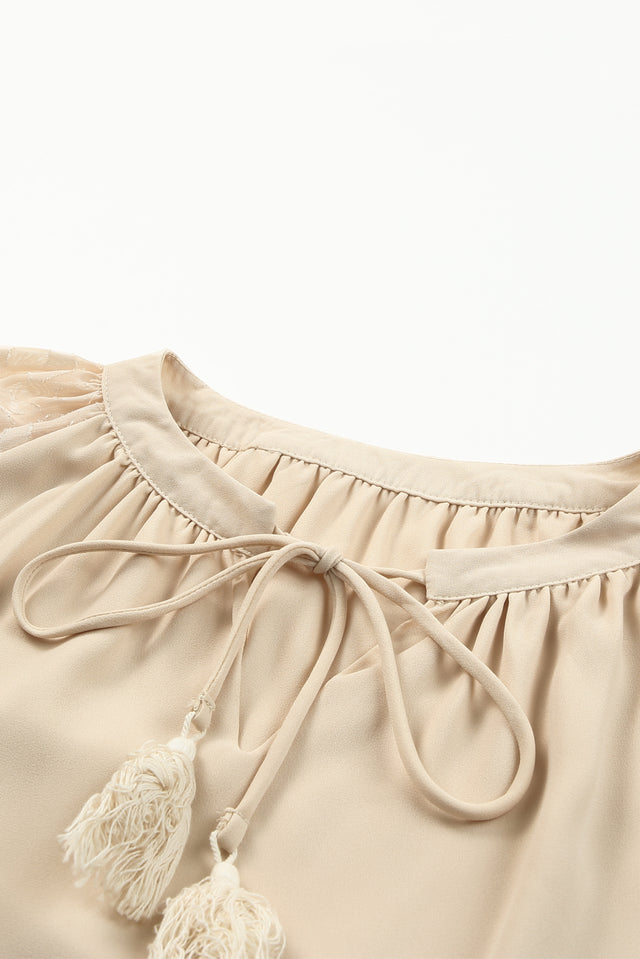 Tassel Tie Neck Long Sleeve Blouse.