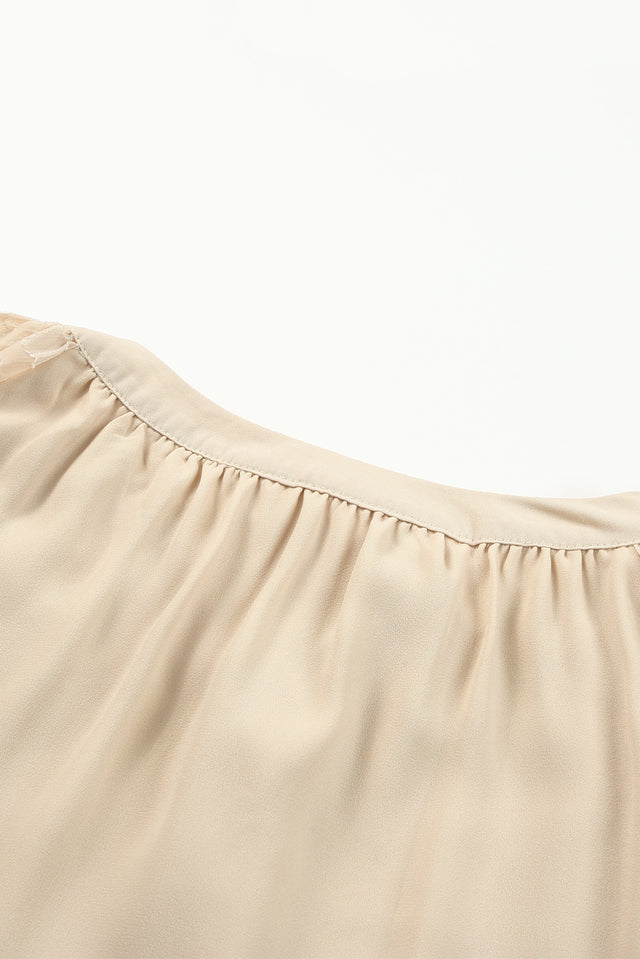 Tassel Tie Neck Long Sleeve Blouse.