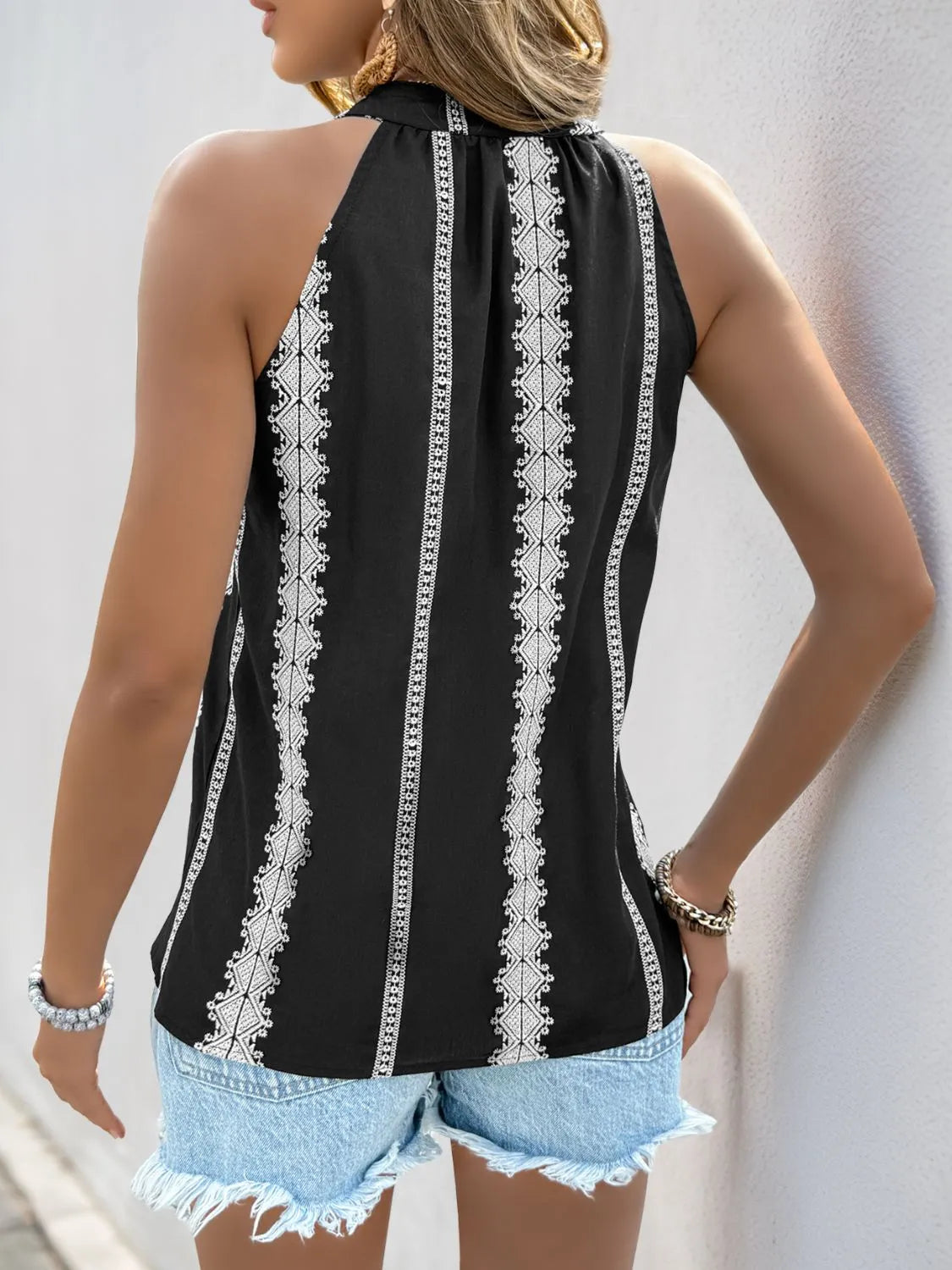 Tassel tied embroidered tank.