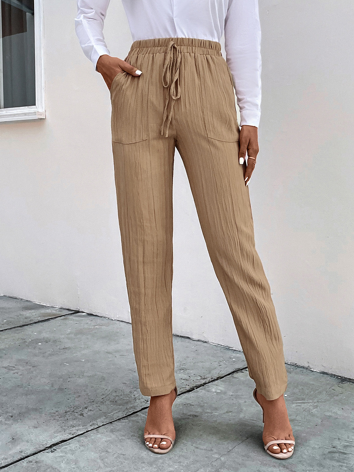 Texture drawstring pants with pockets, opaque.