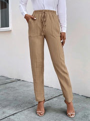 Texture drawstring pants with pockets, opaque.