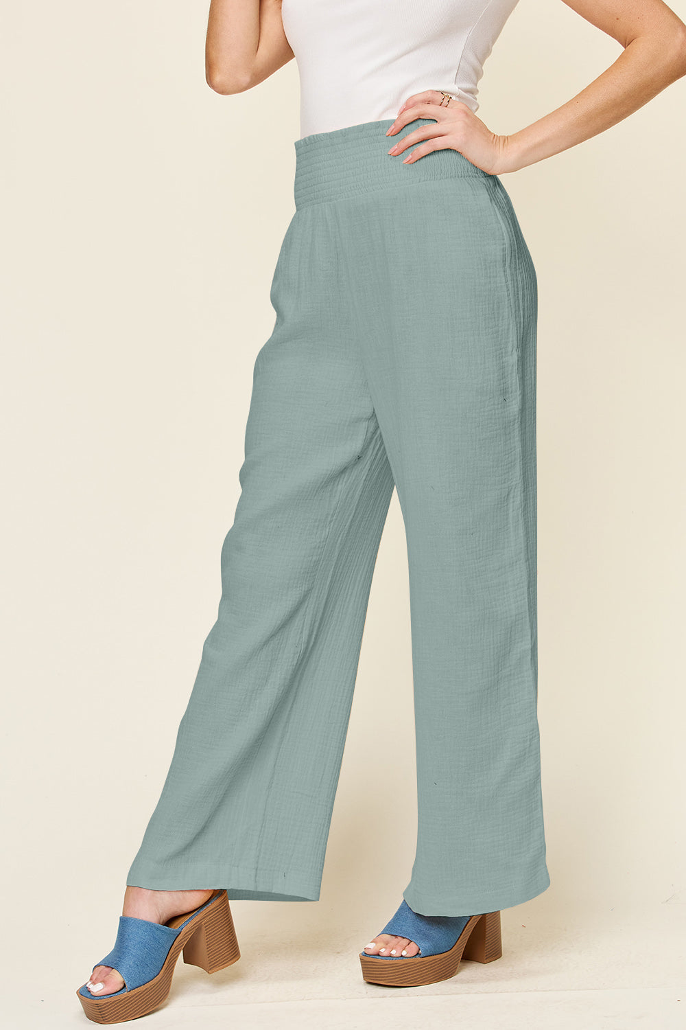 Texture smocked waist wide leg pants, opaque.