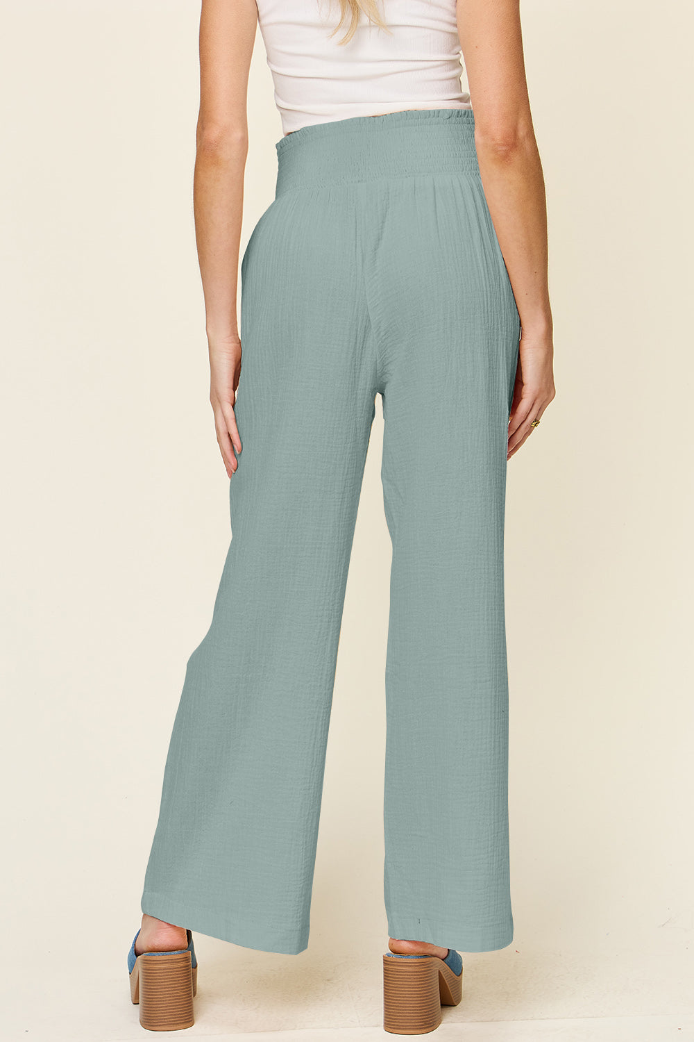 Texture smocked waist wide leg pants, opaque.