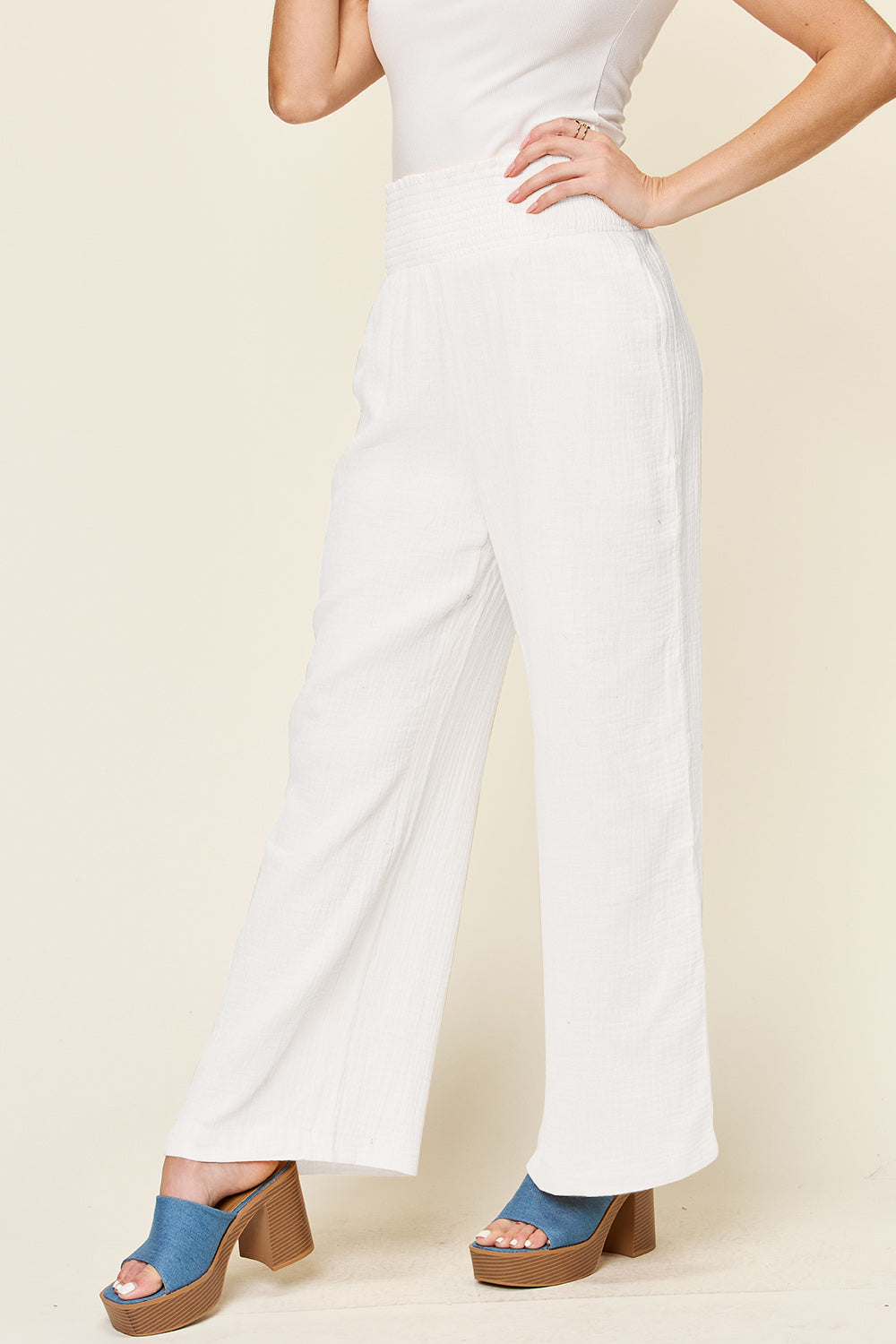 Texture smocked waist wide leg pants, opaque.