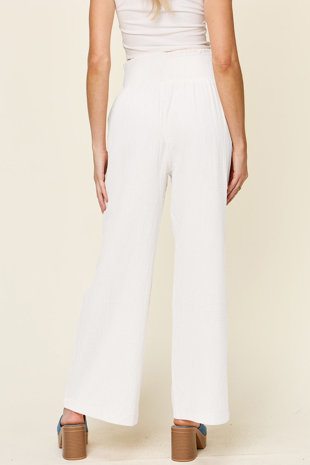 Texture smocked waist wide leg pants, opaque.