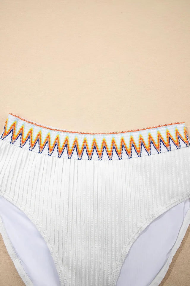 Textured contrast banding high-waist bikini swimsuit with removable padding.