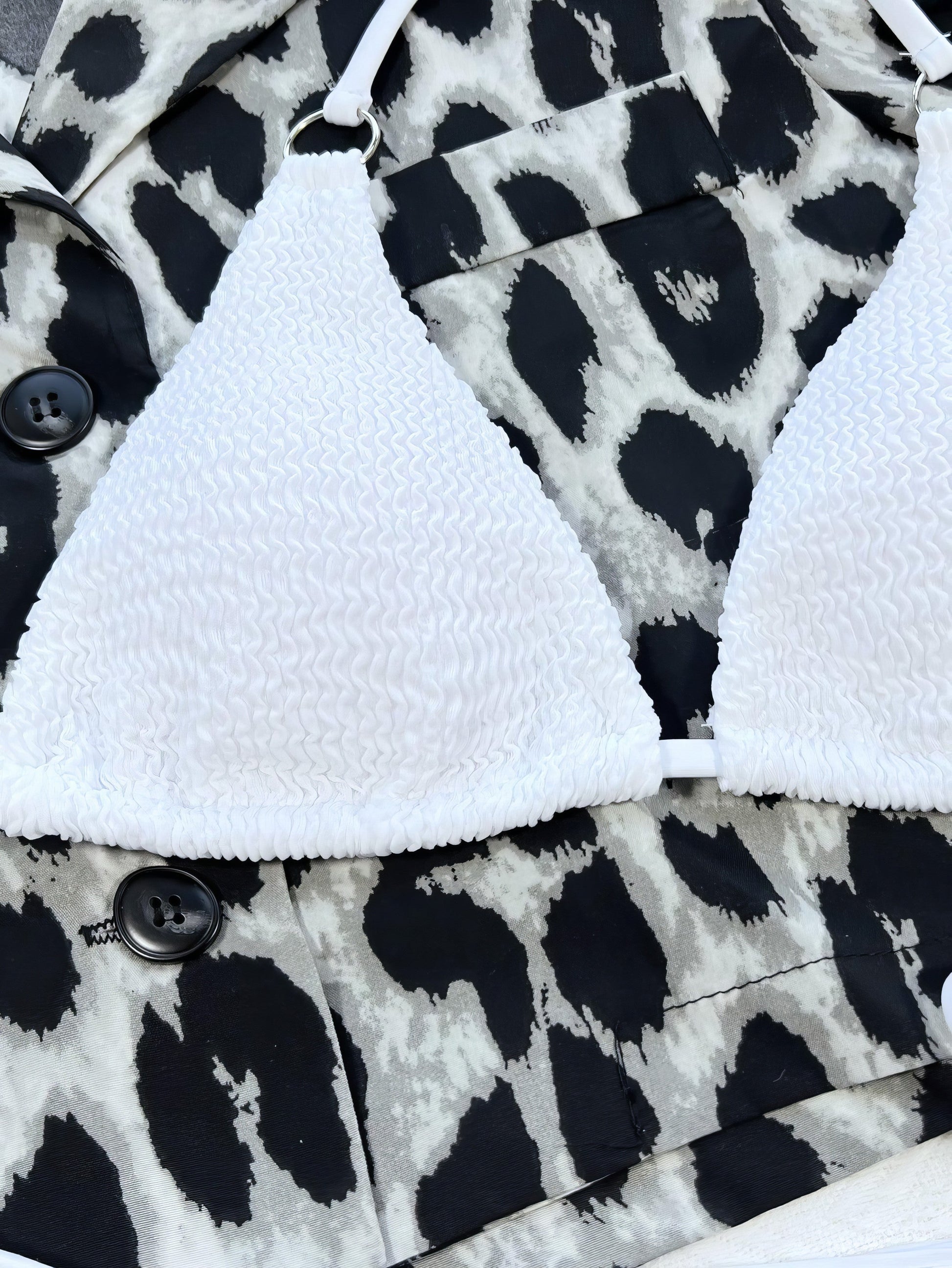 Solid textured halter neck bikini set with tie-side bottoms and crisscross details.