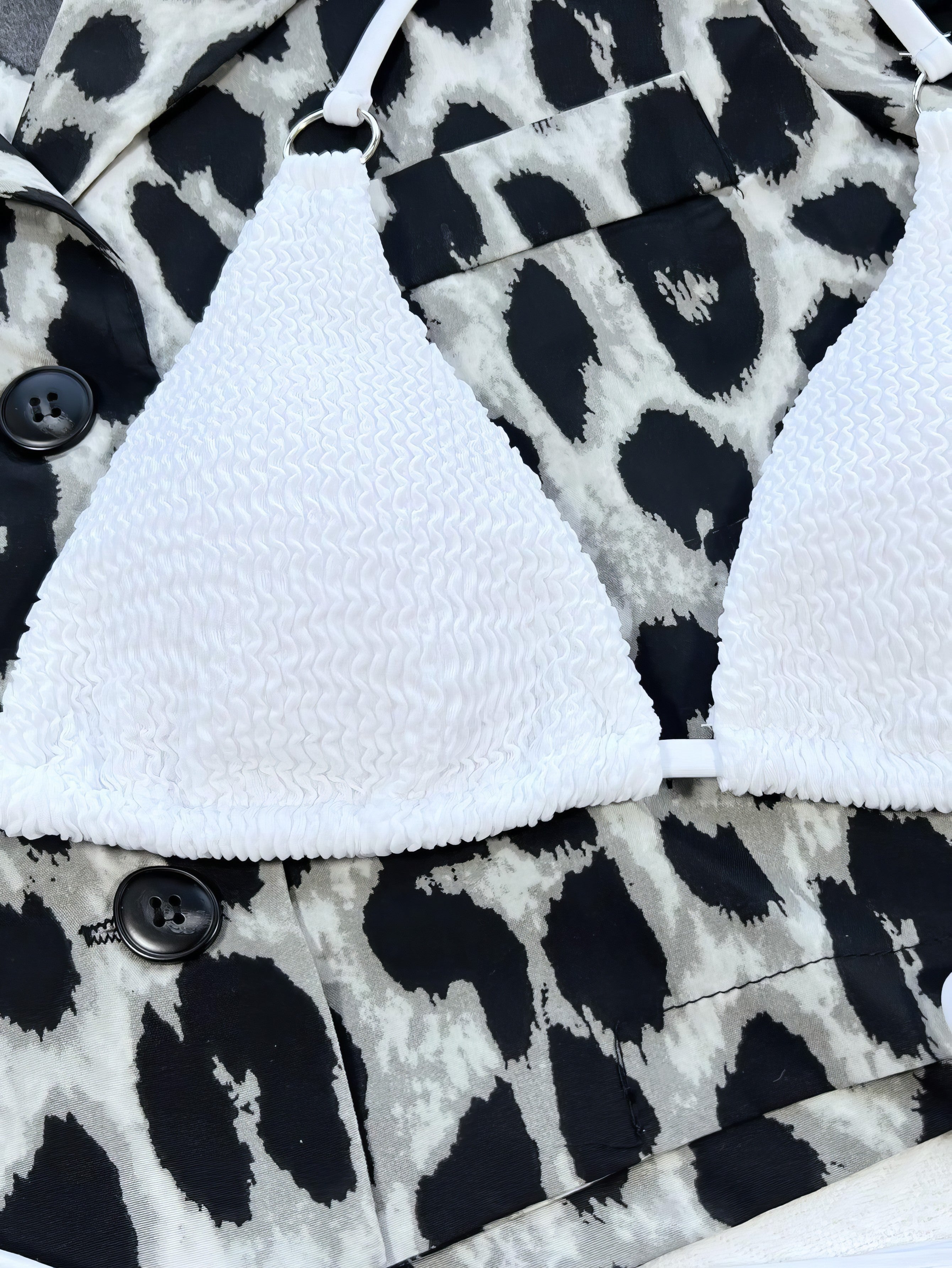 Solid textured halter neck bikini set with tie-side bottoms and crisscross details.