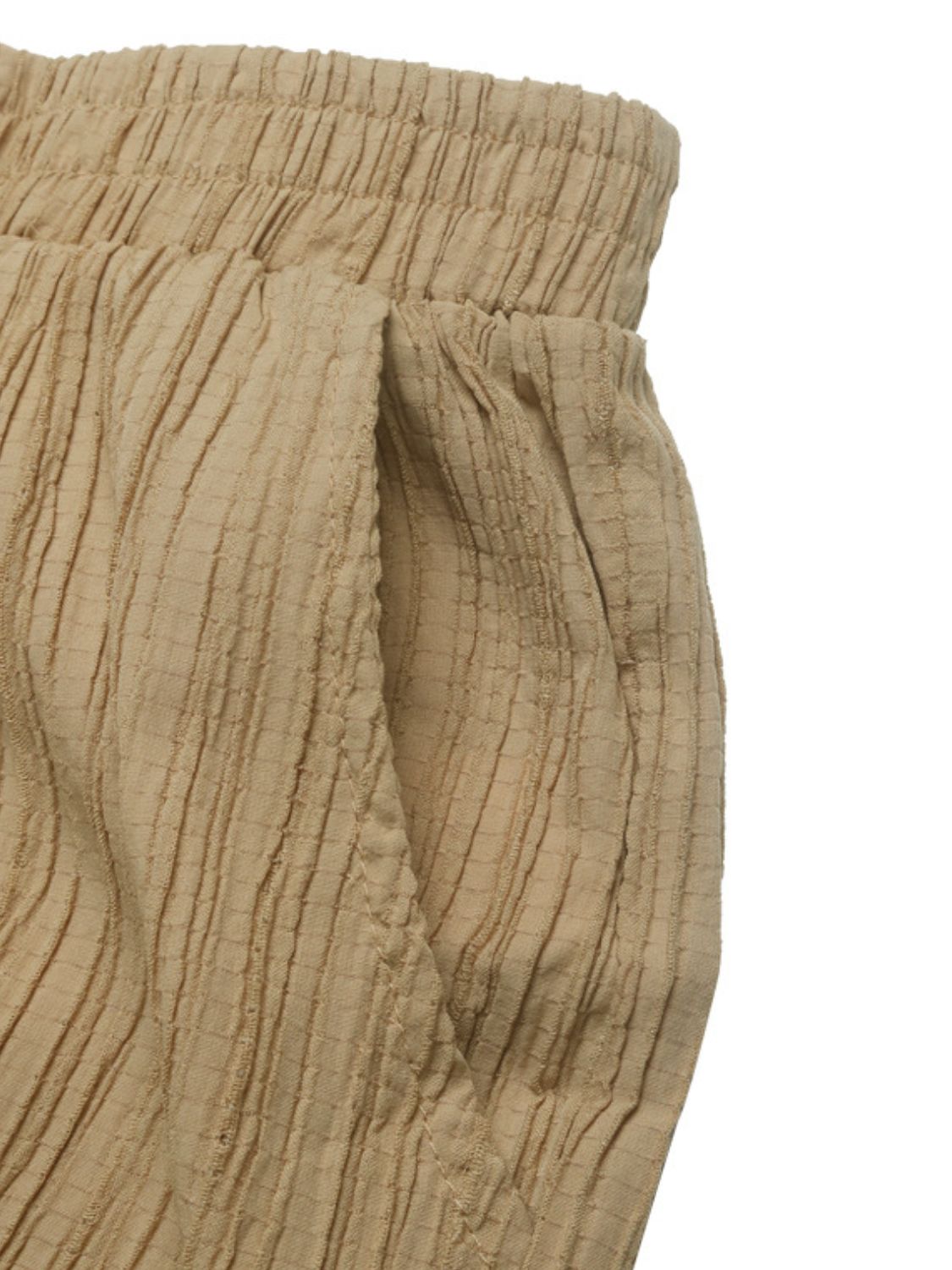 Textured high waist joggers with tie and pockets, opaque.