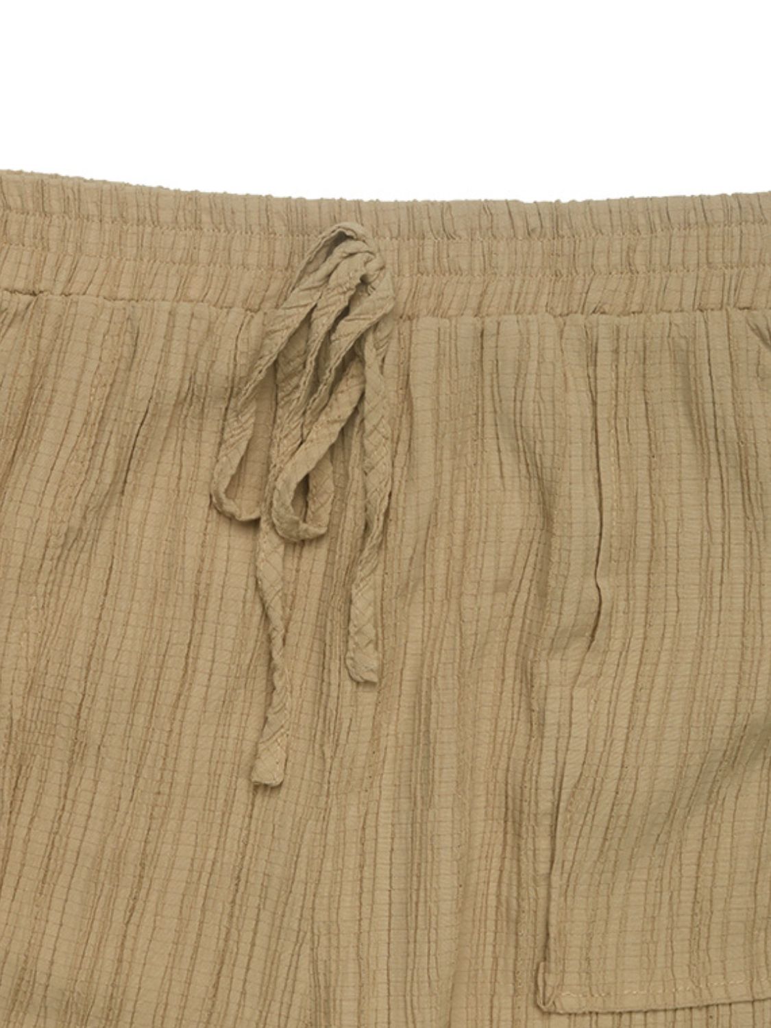 Textured high waist joggers with tie and pockets, opaque.