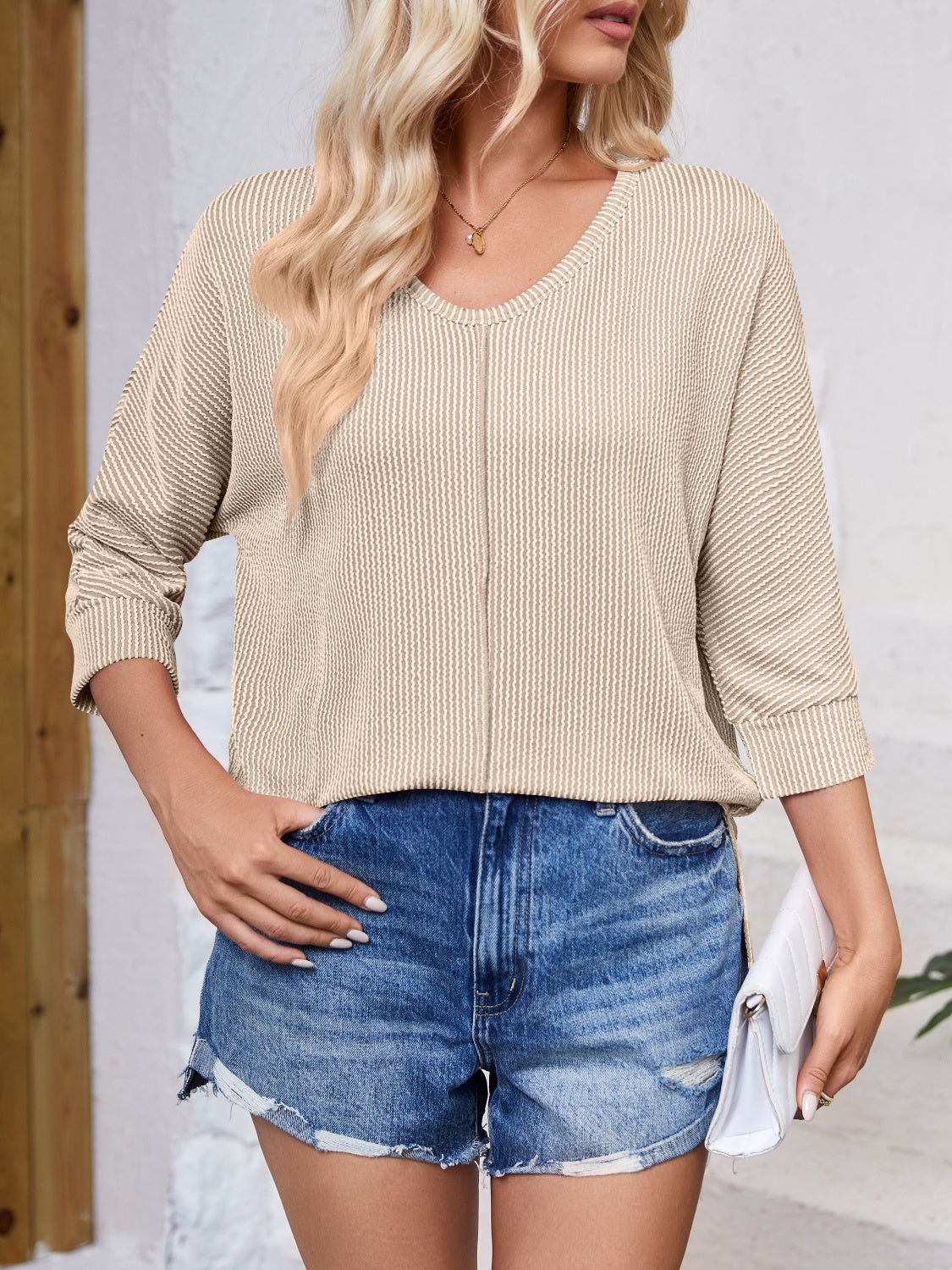 Lovelet Textured Round Neck Three-Quarter Sleeve Blouse.