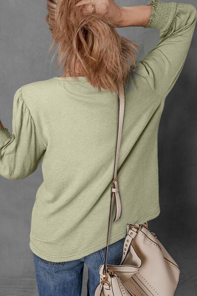 Textured Round Neck Three-Quarter Sleeve Blouse.