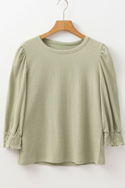 Textured Round Neck Three-Quarter Sleeve Blouse.