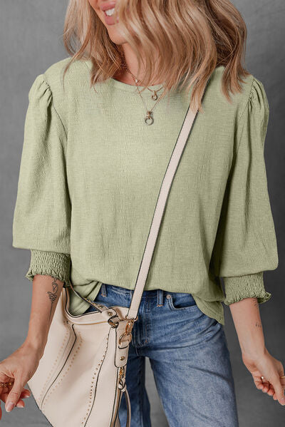 Textured Round Neck Three-Quarter Sleeve Blouse.