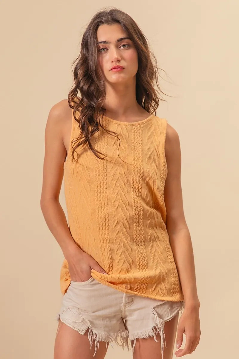 Textured sweater knit twist back sleeveless top with cable-knit design, slightly stretchy.