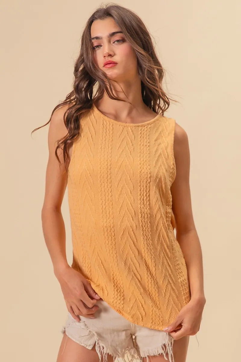 Textured sweater knit twist back sleeveless top with cable-knit design, slightly stretchy.